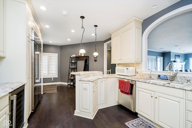 11319 Shoreview Ln, Indianapolis, IN 46236 - kitchen featuring wine cooler, a sink, appliances with stainless steel finishes, a peninsula, and dark wood-style floors