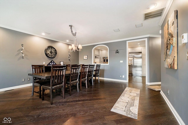 11319 Shoreview Ln, Indianapolis, IN 46236 - dining room with arched walkways, wood finished floors, baseboards, ornamental molding, and a chandelier