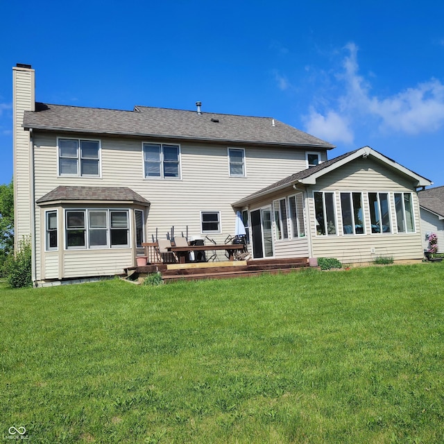 4719 Arabian Run, Indianapolis, IN 46228 - rear view of house with a chimney, a yard, a wooden deck, and a sunroom