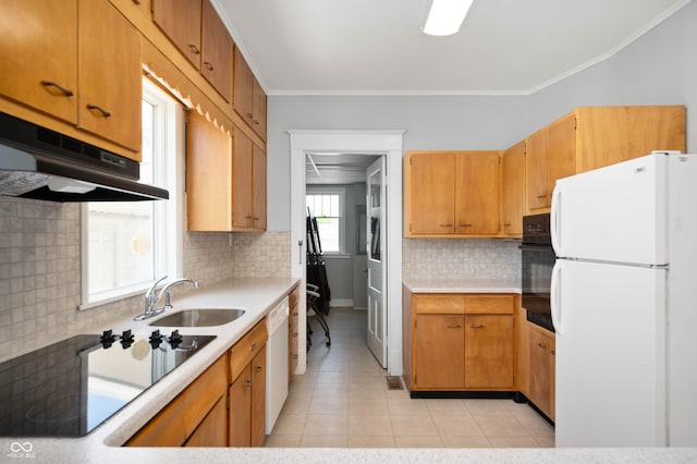 kitchen with black appliances, a sink, backsplash, light tile patterned flooring, and light countertops