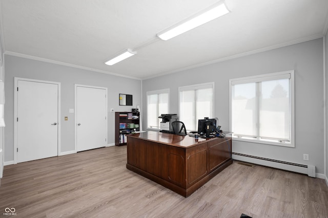 office area with a baseboard heating unit, light wood finished floors, crown molding, and baseboards