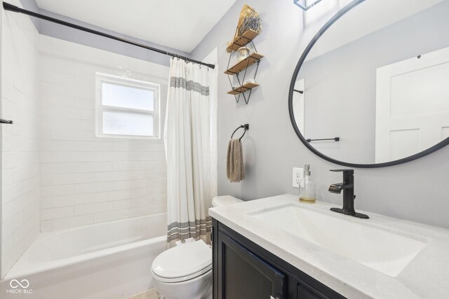 4245 Guilford Ave, Indianapolis, IN 46205 - full bath featuring toilet, vanity, and shower / tub combo with curtain