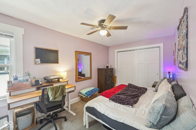 4245 Guilford Ave, Indianapolis, IN 46205 - bedroom with carpet, a desk, a closet, baseboards, and a ceiling fan