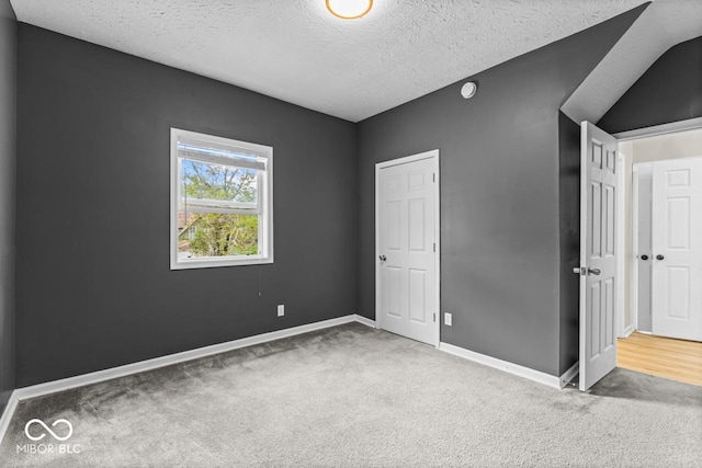 1505 Spann Ave, Indianapolis, IN 46203 - unfurnished bedroom featuring carpet floors, a textured ceiling, and baseboards