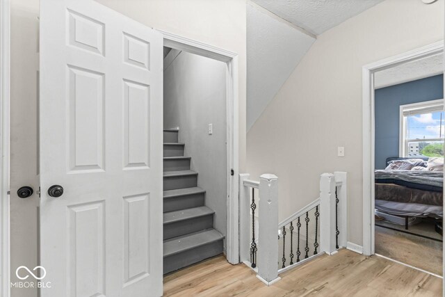 1505 Spann Ave, Indianapolis, IN 46203 - stairway with wood finished floors and vaulted ceiling