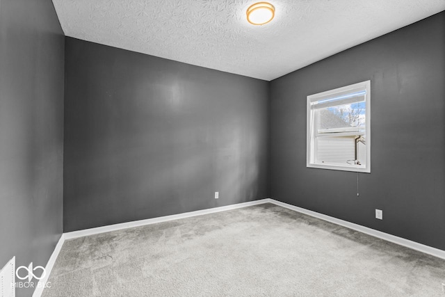 1505 Spann Ave, Indianapolis, IN 46203 - spare room featuring carpet flooring, a textured ceiling, and baseboards