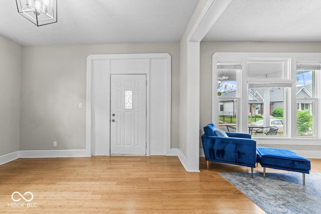 1505 Spann Ave, Indianapolis, IN 46203 - entrance foyer with baseboards, light wood finished floors, and a textured ceiling