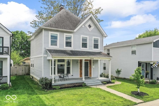 1505 Spann Ave, Indianapolis, IN 46203 - view of front of property featuring a shingled roof, a porch, and a chimney