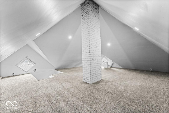 1505 Spann Ave, Indianapolis, IN 46203 - additional living space with lofted ceiling, carpet floors, and decorative columns