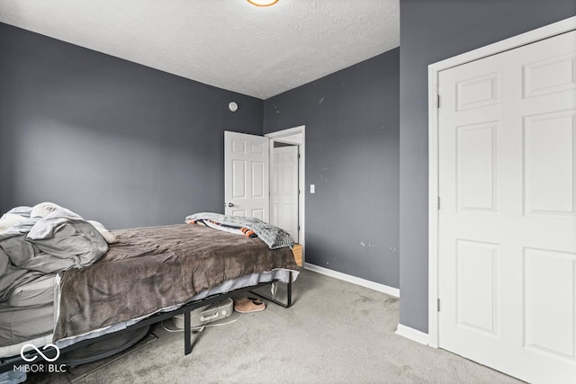 1505 Spann Ave, Indianapolis, IN 46203 - carpeted bedroom featuring baseboards and a textured ceiling