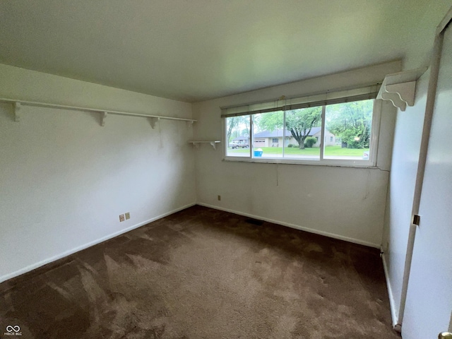 1949 Shenandoah Pl, Indianapolis, IN 46229 - unfurnished room featuring dark carpet and baseboards