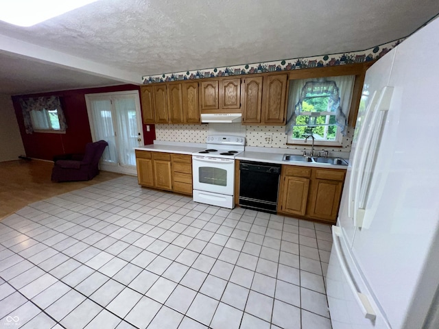 1949 Shenandoah Pl, Indianapolis, IN 46229 - kitchen featuring white appliances, a sink, under cabinet range hood, light countertops, and a textured ceiling