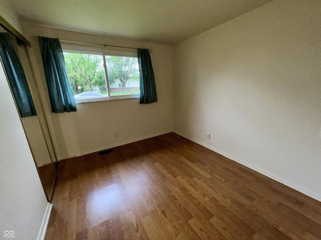 1949 Shenandoah Pl, Indianapolis, IN 46229 - empty room with wood finished floors and baseboards