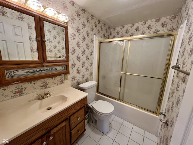 1949 Shenandoah Pl, Indianapolis, IN 46229 - bathroom with tile patterned floors, wallpapered walls, vanity, enclosed tub / shower combo, and toilet