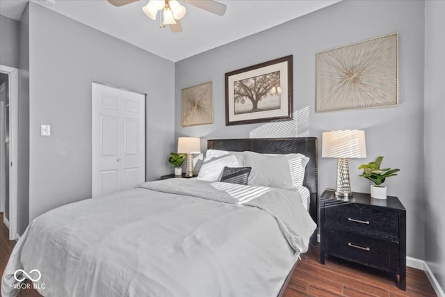 3818 Central Ave, Indianapolis, IN 46205 - bedroom featuring dark wood-type flooring, a closet, baseboards, and ceiling fan