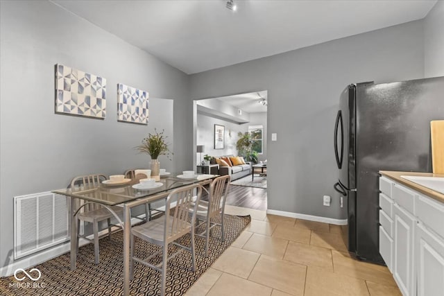 3818 Central Ave, Indianapolis, IN 46205 - dining room featuring light tile patterned flooring and baseboards