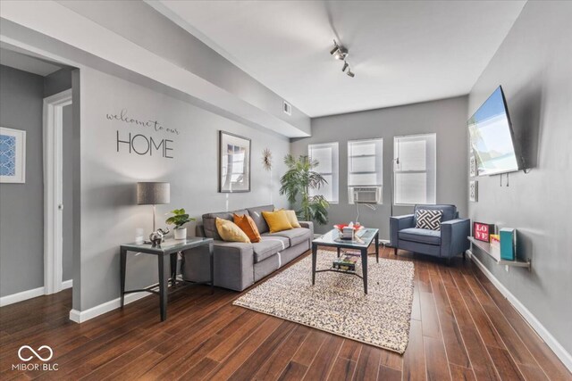 3818 Central Ave, Indianapolis, IN 46205 - living room with dark wood-style flooring, baseboards, and rail lighting