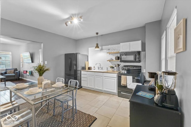 3818 Central Ave, Indianapolis, IN 46205 - kitchen with black appliances, a sink, white cabinets, and open shelves