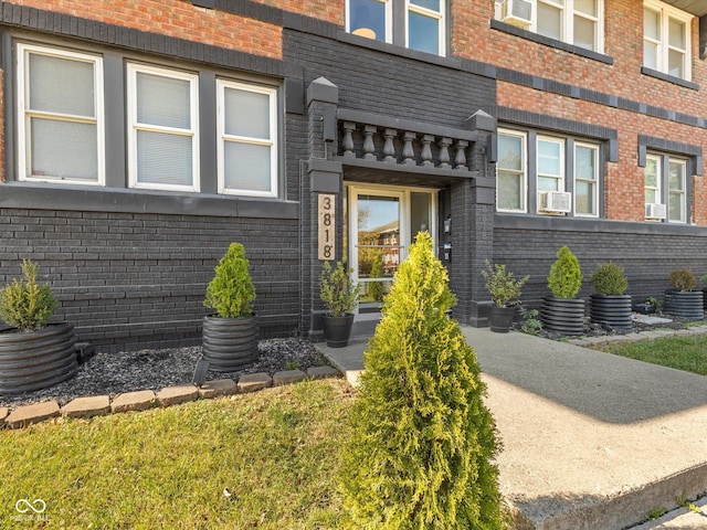3818 Central Ave, Indianapolis, IN 46205 - entrance to property with brick siding and central air condition unit