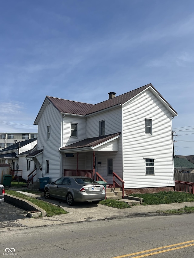 1420 Indiana Ave, New Castle, IN 47362 - view of front of home featuring metal roof and a chimney