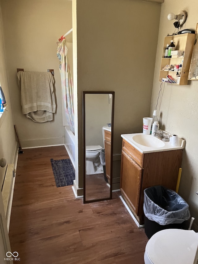 1420 Indiana Ave, New Castle, IN 47362 - full bathroom with toilet, wood finished floors, shower / bath combination with curtain, vanity, and baseboards