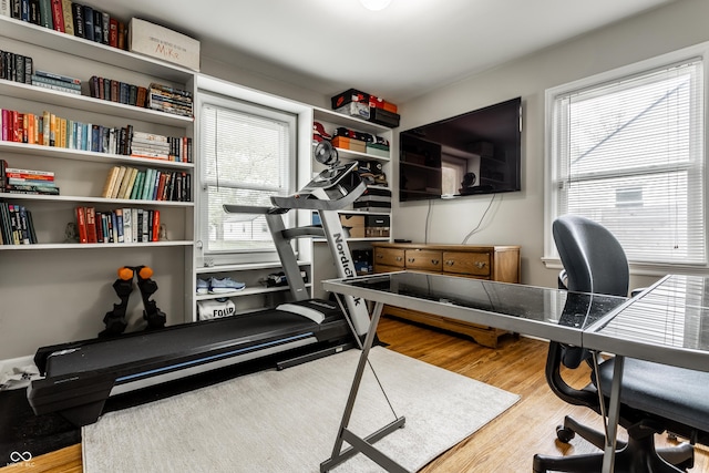 workout area featuring wood finished floors