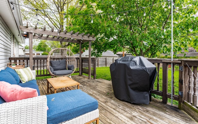 wooden terrace featuring a pergola, grilling area, and fence