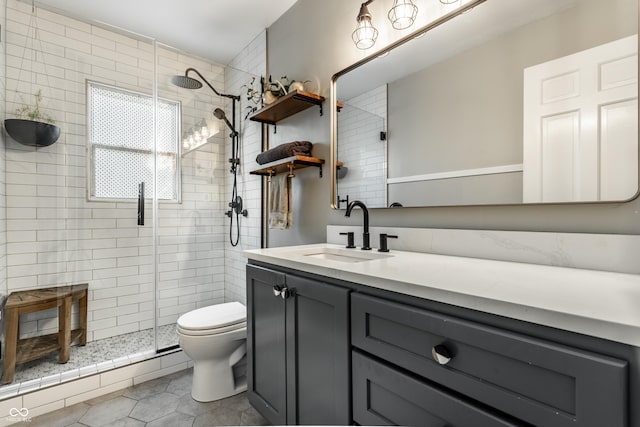 full bathroom with toilet, a shower stall, vanity, and tile patterned floors