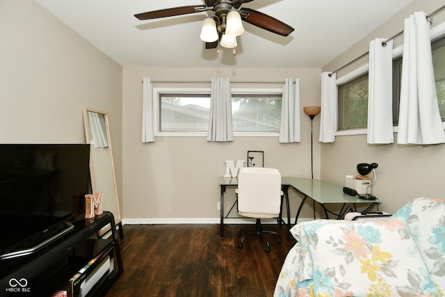 bedroom with ceiling fan, baseboards, and wood finished floors