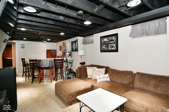 living room with carpet flooring and a bar