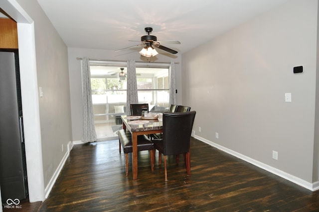 dining room with baseboards, dark wood-style flooring, and a ceiling fan