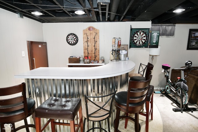 bar with carpet flooring and a dry bar