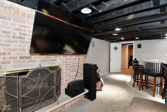 recreation room featuring baseboards and carpet floors