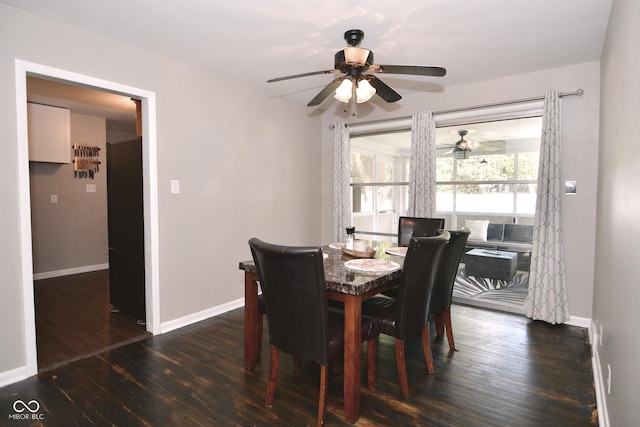 dining room with baseboards, a ceiling fan, and wood finished floors