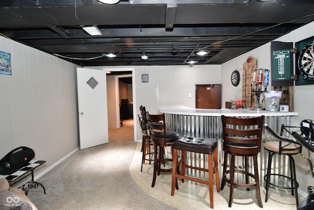 bar featuring a bar and carpet