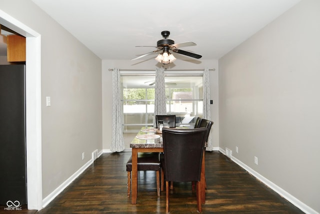 dining room with baseboards, dark wood-style flooring, a ceiling fan, and visible vents