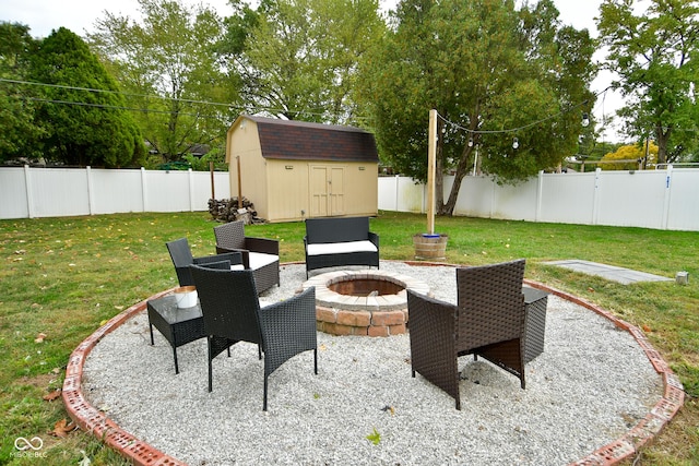 view of patio with an outdoor fire pit, an outdoor structure, a shed, and a fenced backyard