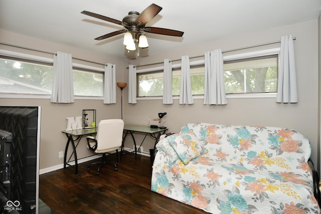 bedroom featuring wood finished floors, baseboards, and ceiling fan