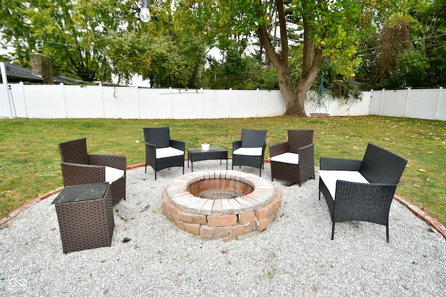 view of patio with an outdoor fire pit and a fenced backyard