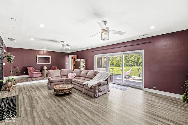 living area featuring wood finished floors, ceiling fan, baseboards, and recessed lighting