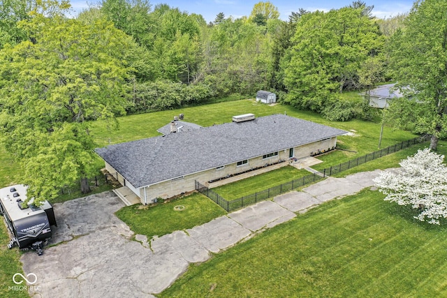 view of subject property with a heavily wooded area