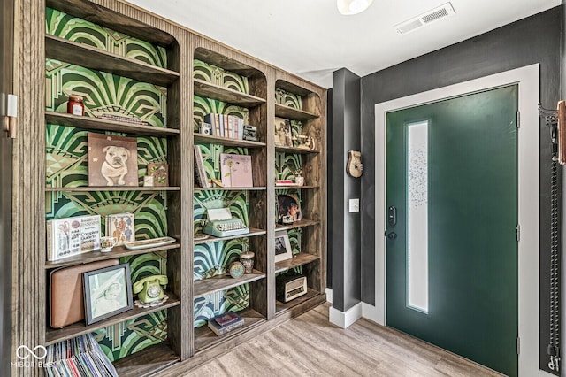 doorway with wood finished floors