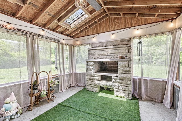sunroom with a skylight, healthy amount of natural light, and vaulted ceiling