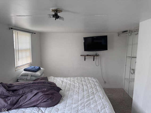 carpeted bedroom with a ceiling fan
