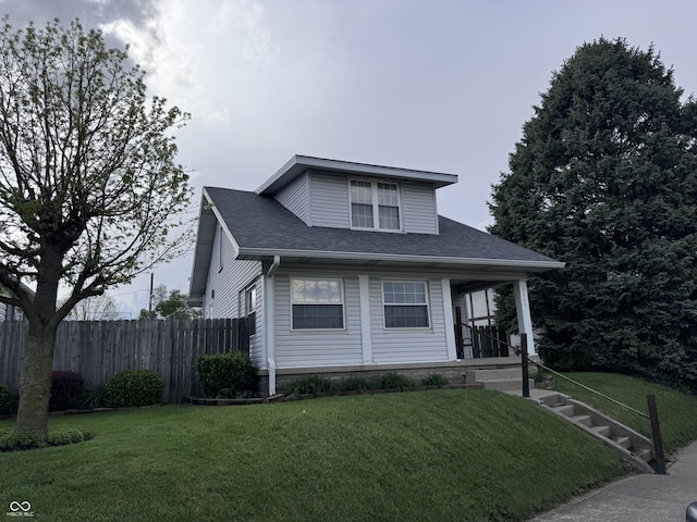 bungalow featuring covered porch and roof with shingles