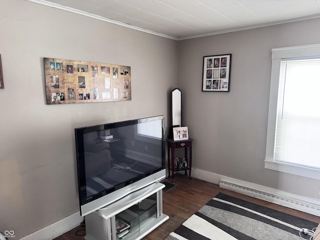 detailed view of wood finished floors, crown molding, baseboards, and a baseboard radiator