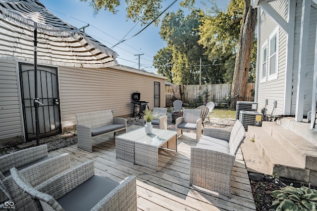 2407 N Capitol Ave, Indianapolis, IN 46208 - wooden deck featuring an outdoor hangout area, fence, and central AC