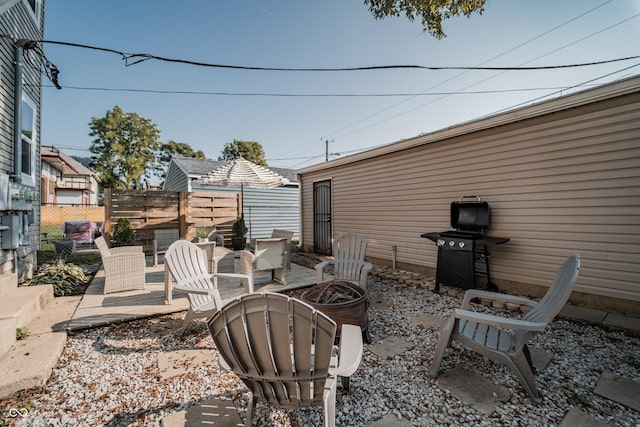 2407 N Capitol Ave, Indianapolis, IN 46208 - view of patio featuring a fire pit, fence, and a grill