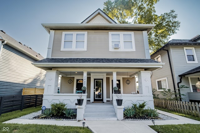 2407 N Capitol Ave, Indianapolis, IN 46208 - view of front of home with covered porch, fence, and a shingled roof