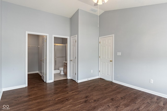 4136 Orchard Valley Ln, Indianapolis, IN 46235 - unfurnished bedroom featuring high vaulted ceiling, baseboards, dark wood-type flooring, a spacious closet, and a closet